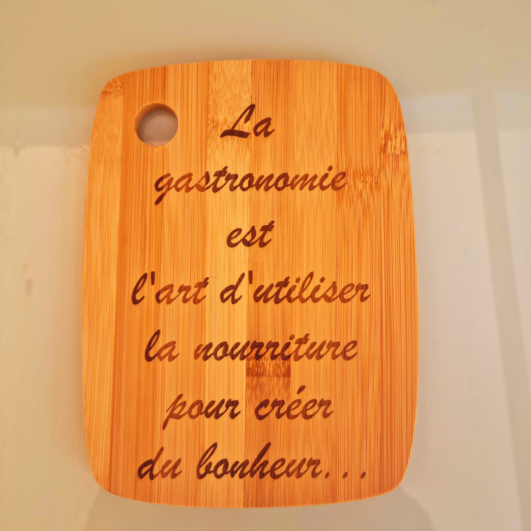 Planche "La gastronomie est l'art d'utiliser la nourriture pour créer du bonheur"