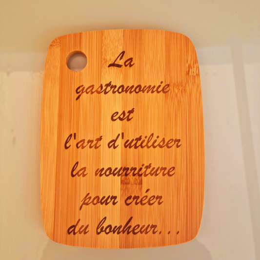 Planche "La gastronomie est l'art d'utiliser la nourriture pour créer du bonheur"